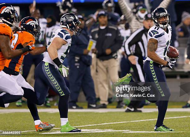 Wide receiver Percy Harvin of the Seattle Seahawks runs 87-yards to score a touchdown against the Denver Broncos in the third quarter during Super...