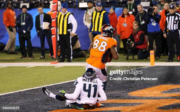 Wide receiver Demaryius Thomas of the Denver Broncos scores on a 14 yard pass during Super Bowl XLVIII against the Seattle Seahawks at MetLife...