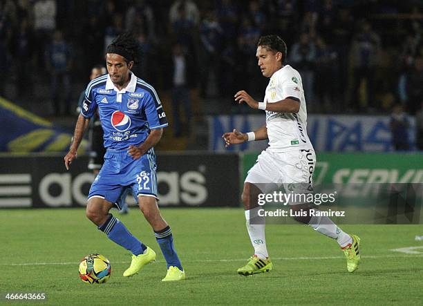 Fabian Vargas of Millonarios vies for the ball with Henry Hernandez of la Equidad during a match between Millonarios and La Equidad as part of the...