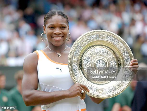 Serena Williams of the USA holds aloft her trophy, after defeating her sister Venus Williams in the Womens Singles Final during day twelve of the...