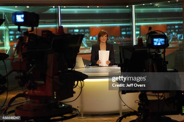 Behind the scenes view of Fiona Bruce preparing to read the Ten O'Clock News bulletin. Ten O'Clock News studio, cameras. .