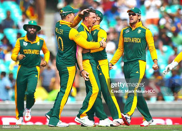 Dale Steyne of South Africa celebrates a wicket with team mates during the 2015 ICC Cricket World Cup match between South Africa and Sri Lanka at...