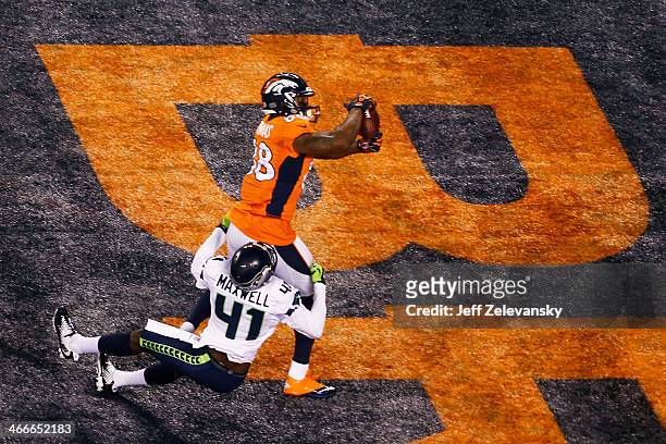 Wide receiver Demaryius Thomas of the Denver Broncos scores on a 14 yard pass during Super Bowl XLVIII against the Seattle Seahawks at MetLife...