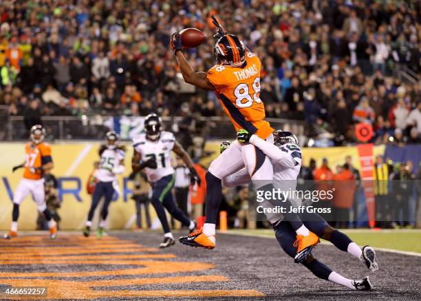 Wide receiver Demaryius Thomas of the Denver Broncos ran 14 yards to score a touchdown in the third quarter against cornerback Byron Maxwell of the...