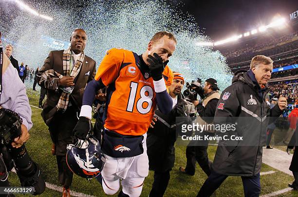 Quarterback Peyton Manning of the Denver Broncos reacts as he walks off the field after their 43-8 loss to the Seattle Seahawks during Super Bowl...