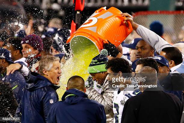 Head coach Pete Carroll of the Seattle Seahawks get Gatorade dumped on him at the end of Super Bowl XLVIII at MetLife Stadium on February 2, 2014 in...