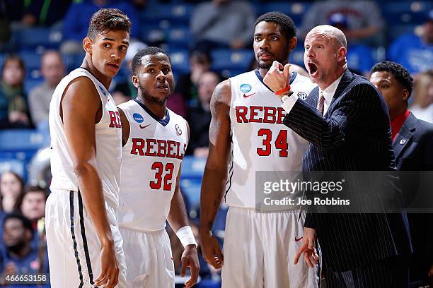 Head coach Andy Kennedy of the Mississippi Rebels speaks with his players against the Brigham Young Cougars during the first round of the 2015 NCAA...
