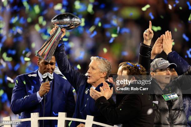 Head coach Pete Carroll of the Seattle Seahawks celebrates with the Vince Lombardi Trophy after their 43-8 victory over the Denver Broncos during...