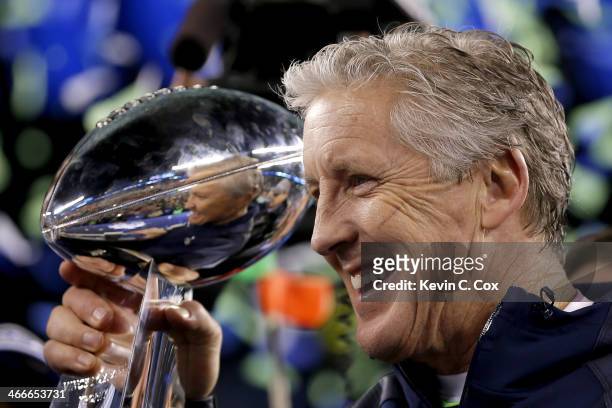 Head coach Pete Carroll of the Seattle Seahawks celebrates with the Vince Lombardi Trophy after their 43-8 victory over the Denver Broncos during...
