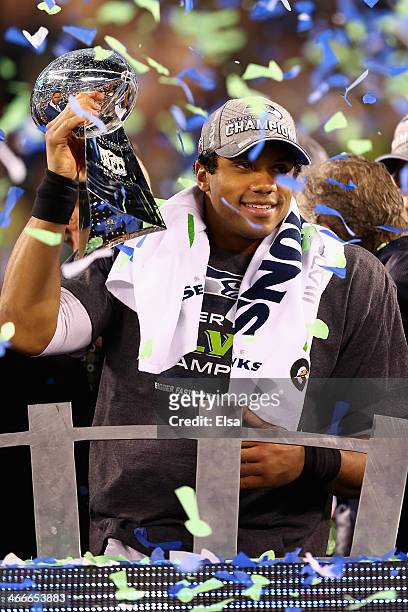 Quarterback Russell Wilson of the Seattle Seahawks holds the Vince Lombardi Trophy after winning Super Bowl XLVIII at MetLife Stadium on February 2,...