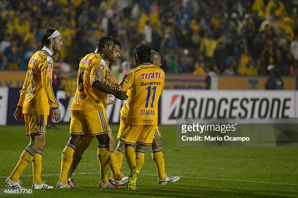 Rafael Sobis of Tigres celebrates with teammates after scoring his team's second goal during a group 6 match between Tigres UANL and San Jose Oruro...