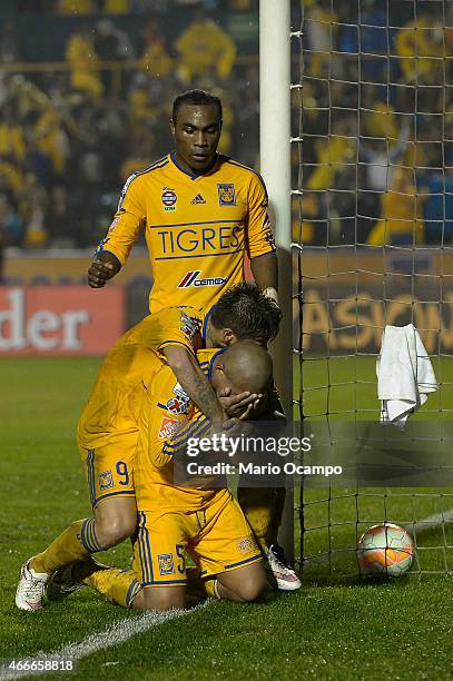 Egidio Arevalo of Tigres celebrates with teammates after scoring his team's third goal during a group 6 match between Tigres UANL and San Jose Oruro...