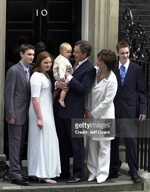 Prime Minister Tony Blair poses with his youngest son Leo, wife Cherie and children Nicholas, Kathryn and Euan on the steps of his official residence...