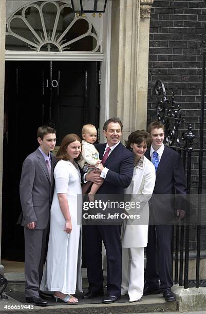 Prime Minister Tony Blair poses with his youngest son Leo, wife Cherie and children Nicholas, Kathryn and Euan on the steps of his official residence...