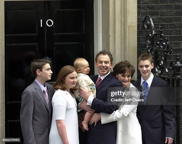 Prime Minister Tony Blair poses with his youngest son Leo, wife Cherie and children Nicholas, Kathryn and Euan on the steps of his official residence...