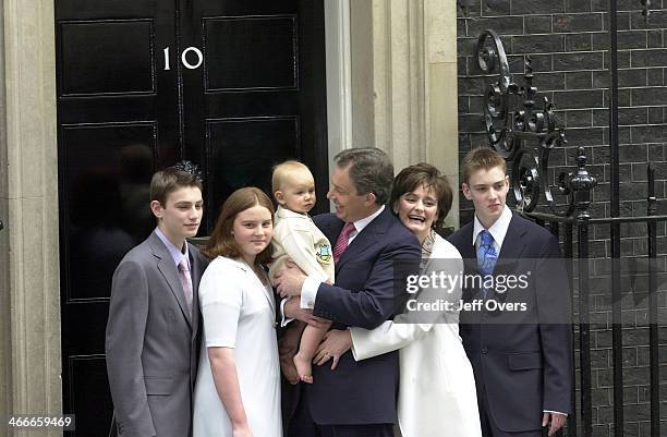 Prime Minister Tony Blair poses with his youngest son Leo, wife Cherie and children Nicholas, Kathryn and Euan on the steps of his official residence...