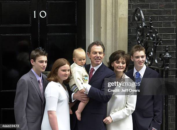 Prime Minister Tony Blair poses with his youngest son Leo, wife Cherie and children Nicholas, Kathryn and Euan on the steps of his official residence...