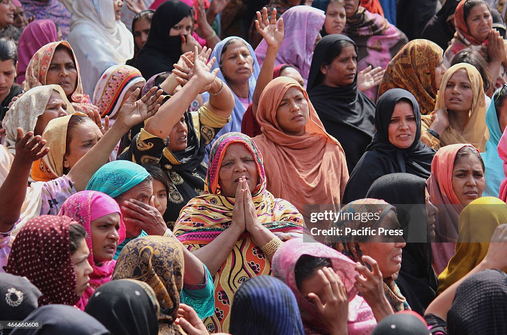 Pakistani Christian community carry the coffin of a victim...