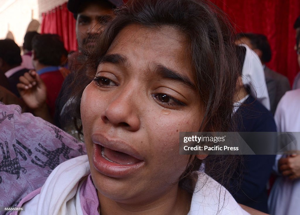 Pakistani Christian community carry the coffin of a victim...