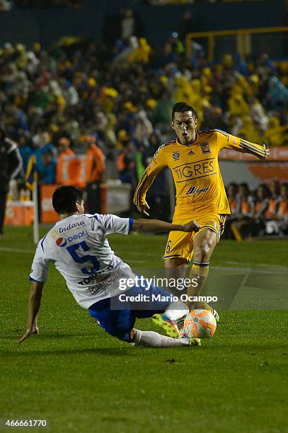 Jorge Torres Nilo of Tigres fights for the ball with Luis Torrico of San Jose Oruro during a group 6 match between Tigres UANL and San Jose Oruro as...