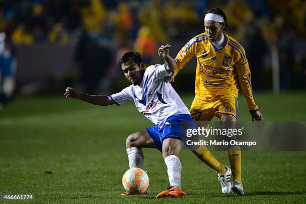 Edgar Lugo of Tigres fights for the ball with Jhosimar Prado of San Jose Oruro during a group 6 match between Tigres UANL and San Jose Oruro as part...