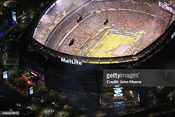 Army helicopters from the 101st Combat Aviation Brigade fly over Metlife Stadium ahead of Super Bowl XLVIII between the Seattle Seahawks and the...