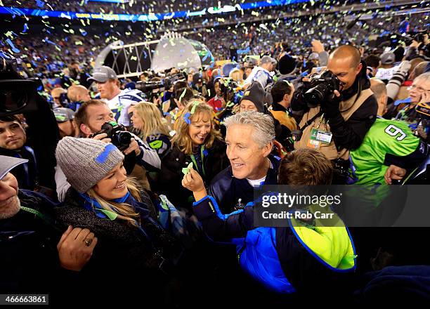 Head coach Pete Carroll of the Seattle Seahawks celebrates with his wife Glena and family after their 43-8 victory over the Denver Broncos during...