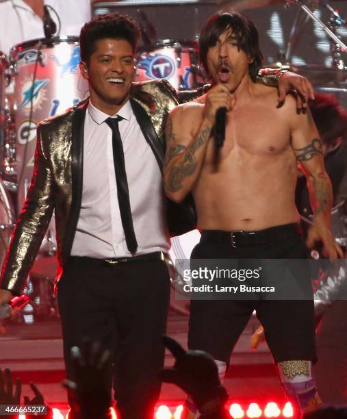 Bruno Mars and Anthony Kiedis of the Red Hot Chili Peppers perform during the Pepsi Super Bowl XLVIII Halftime Show at MetLife Stadium on February 2,...