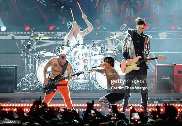 Flea, Chad Smith, Anthony Kiedis and Josh Klinghoffer of the Red Hot Chili Peppers perform during the Pepsi Super Bowl XLVIII Halftime Show at...