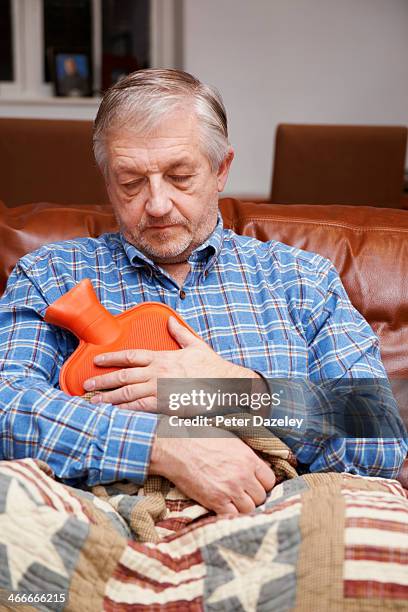 pensioner keeping warm - cold indoors stock pictures, royalty-free photos & images