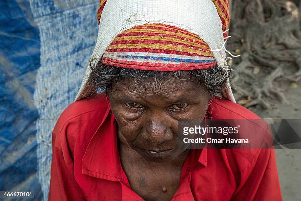 An elderly woman walks in one of the streets of the Beldangi 2 refugee camp on March 13, 2015 in Beldangi, Nepal. More than 22,000 Bhutanese refugees...