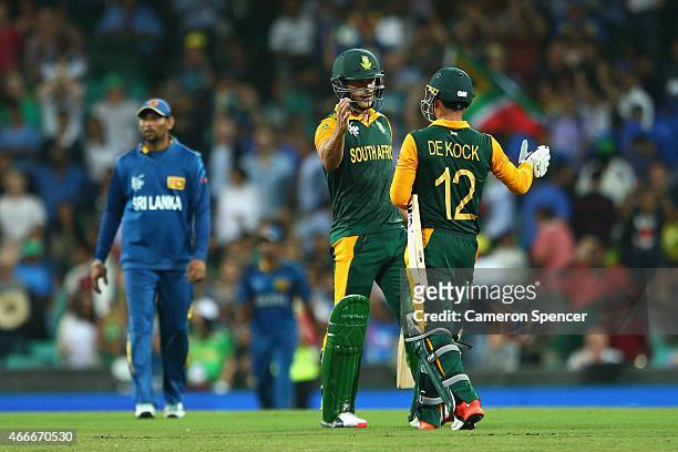 Faf du Plessis of South Africa and team mate Quinton de Kock embrace after winning the 2015 ICC Cricket World Cup match between South Africa and Sri...
