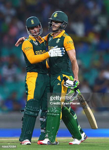 Quinton de Kock and Faf du Plessis of South Africa celebrate victory during the 2015 ICC Cricket World Cup Quarter Final match between South Africa...