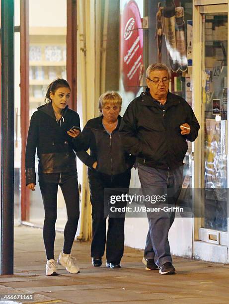 Mila Kunis with her parents Elvira Kunis and Mark Kunis are seen on May 20, 2013 in London, United Kingdom.