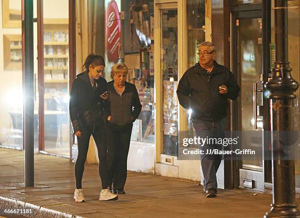 Mila Kunis with her parents Elvira Kunis and Mark Kunis are seen on May 20, 2013 in London, United Kingdom.