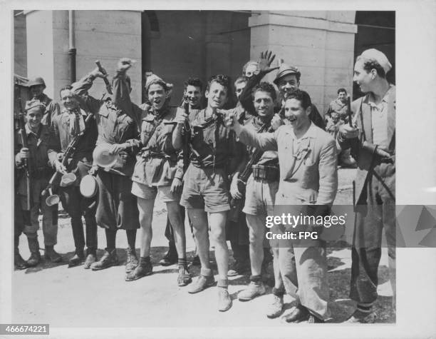 Italian partisans posing for the photographer, prior to their disarmament by the allies during World War Two, Milan, Italy, circa 1939-1945.