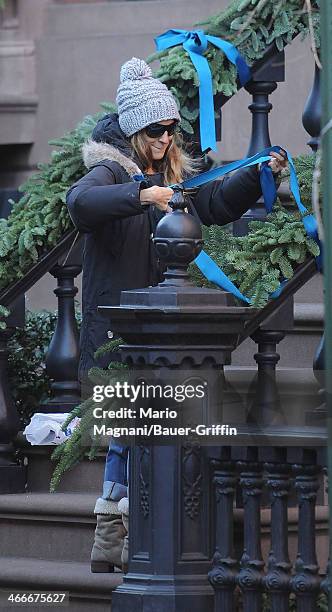 Sarah Jessica Parker is seen putting Christmas decorations on her house on December 19, 2012 in New York City.