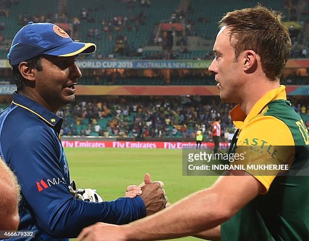 Sri Lanka's cricketer Kumar Sangakkara is greeted by South Africa's captain AB de Villiers after the 2015 Cricket World Cup quarter-final match...