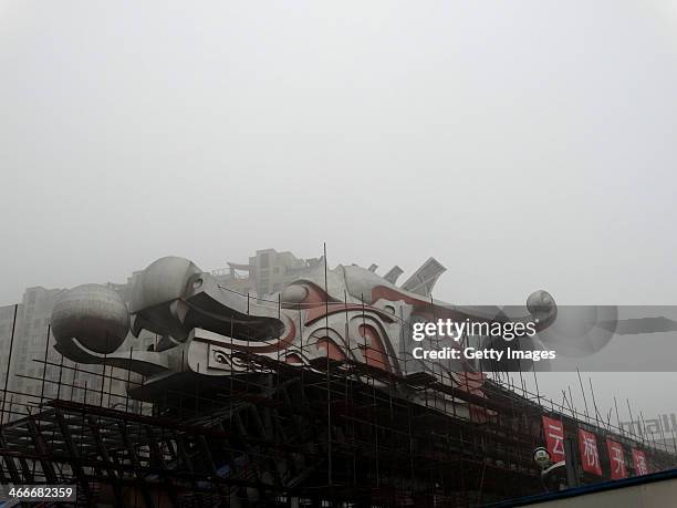 Building is shrouded in smog on February 2, 2014 in Shanghai, China. China's national meteorological authority issues an alert as heavy fog will...