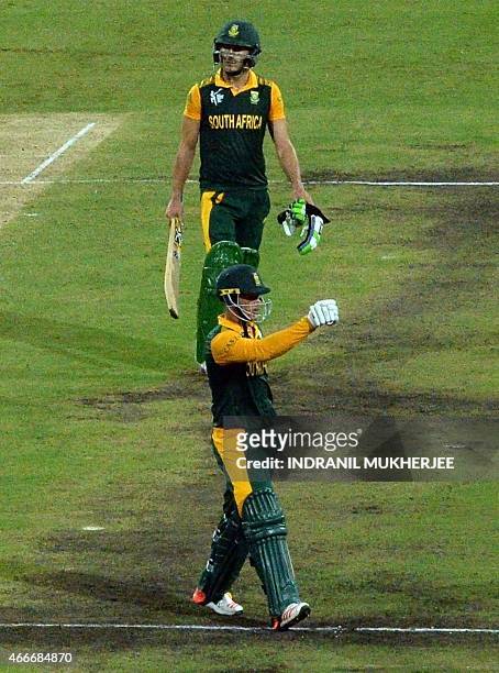 South African batsmn Quinton de Kock and Faf du Plessis celebrate after winning the 2015 Cricket World Cup quarter-final match between Sri Lanka and...