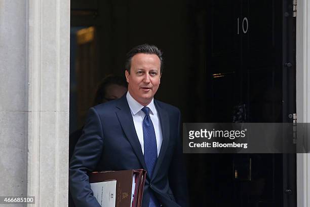 David Cameron, U.K. Prime minister, leaves 10 Downing Street following a pre-budget cabinet meeting in London, U.K., on Wednesday, March 18, 2015....