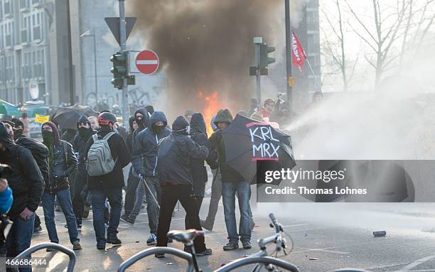 Activists march during a demonstration organized by the Blockupy movement to protest against the policies of the European Central Bank after the ECB...