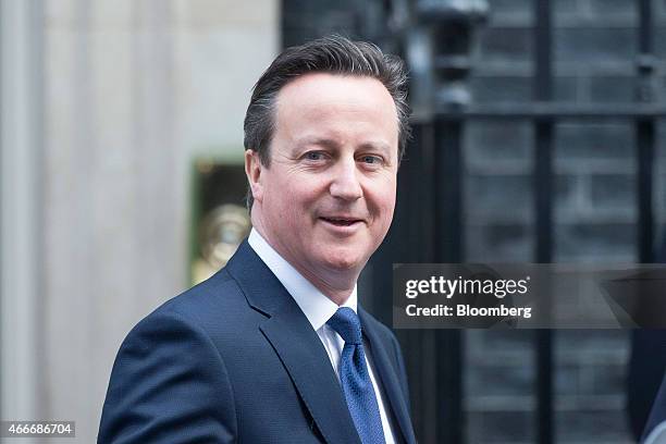 David Cameron, U.K. Prime minister, left, leaves 10 Downing Street following a pre-budget cabinet meeting in London, U.K., on Wednesday, March 18,...