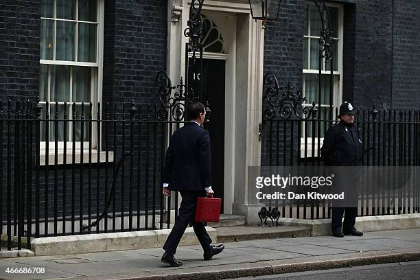 The Chancellor of the Exchequer George Osborne arrives to 11 Downing Street on March 18, 2015 in London, England. The Chancellor is presenting his...