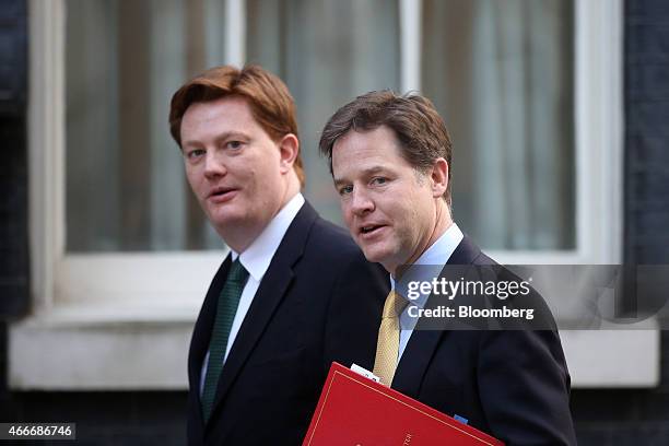 Nick Clegg, U.K. Deputy prime minister, right, and Danny Alexander, U.K. Chief secretary to the treasury, arrive at 10 Downing Street for a...