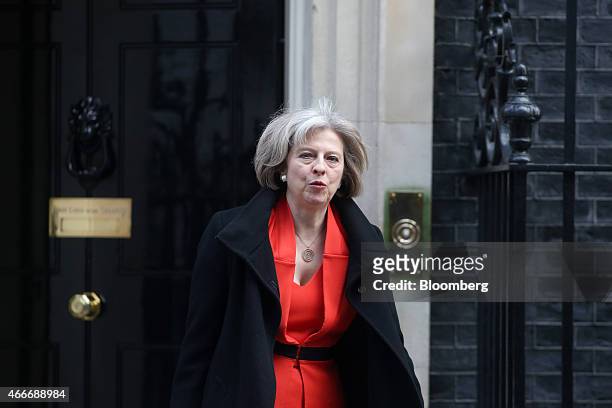 Theresa May, U.K. Home secretary, leaves 10 Downing Street following a pre-budget cabinet meeting in London, U.K., on Wednesday, March 18, 2015....