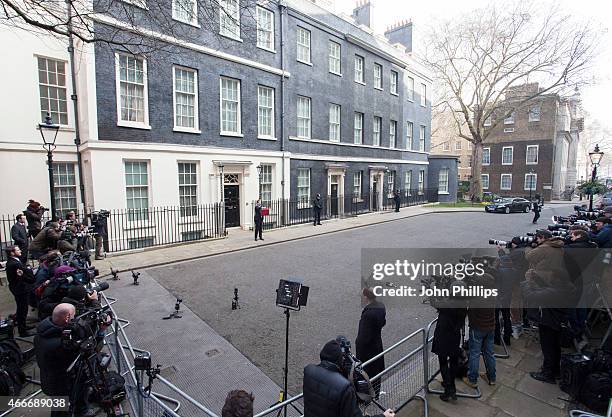 Chancellor of the Exchequer George Osborne holds his ministerial red box up to the media as he leaves number 11 Downing Street for Parliament on...