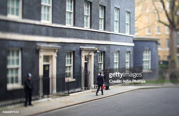 Chancellor of the Exchequer George Osborne leaves number 11 Downing Street for Parliament on March 18, 2015 in London, England. The Chancellor is...