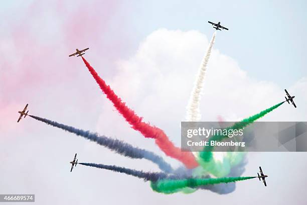 Alenia Aermacchi SpA MB-339 aircraft, operated by the United Arab Emirates Air Force's Al Fursan team, perform in an aerial display at the Langkawi...