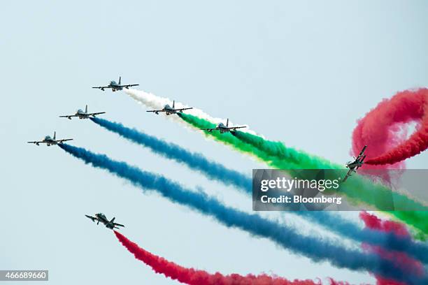 Alenia Aermacchi SpA MB-339 aircraft, operated by the United Arab Emirates Air Force's Al Fursan team, fly in formation during an aerial display at...